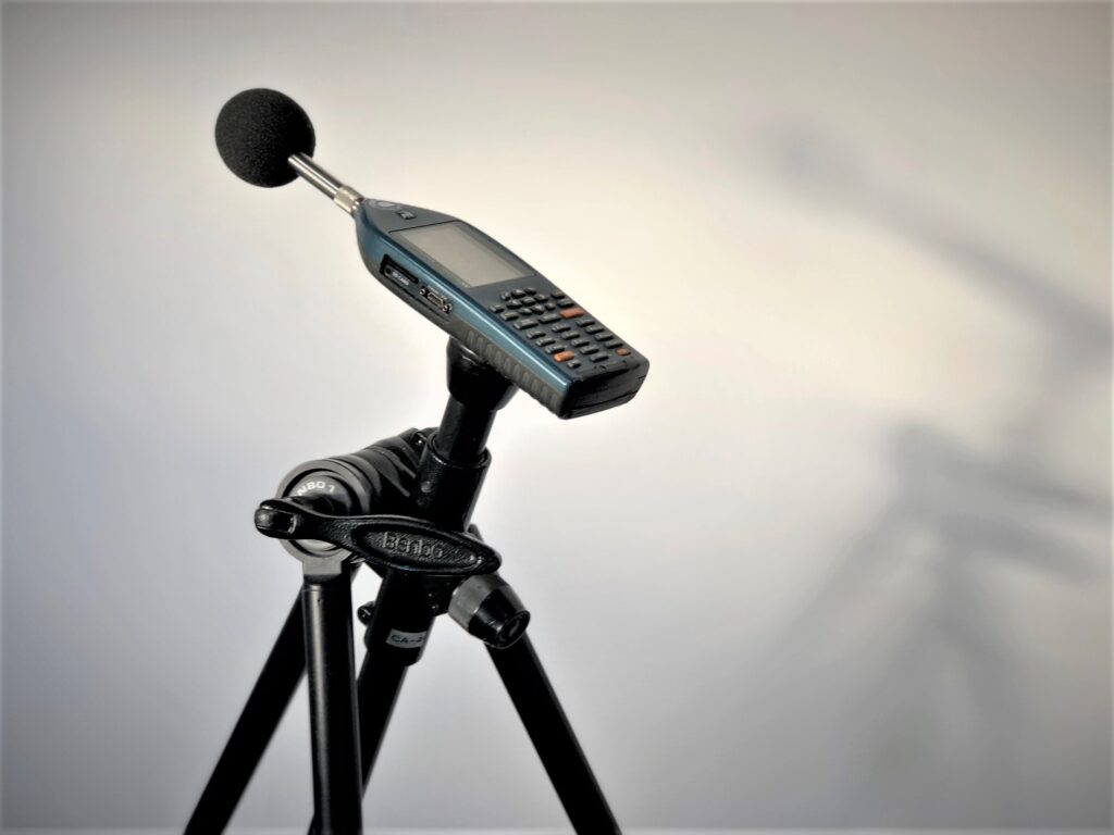 sound meter taking noise level measurements for lease condition sound testing in flats
