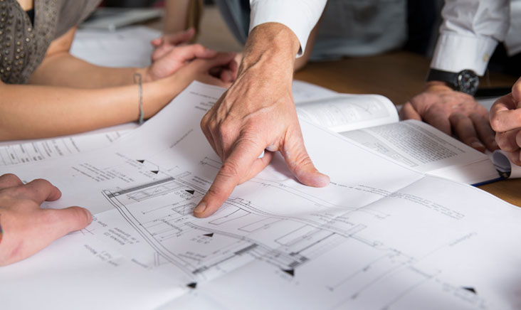 Finger pointing at paper diagram