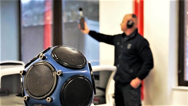 A photograph of our sound test engineer undertaking sound insulation testing in London 